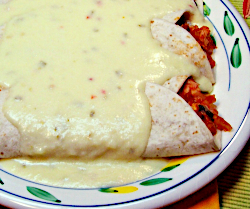 Chicken Enchiladas Smothered with Creamy Cheese Sauce