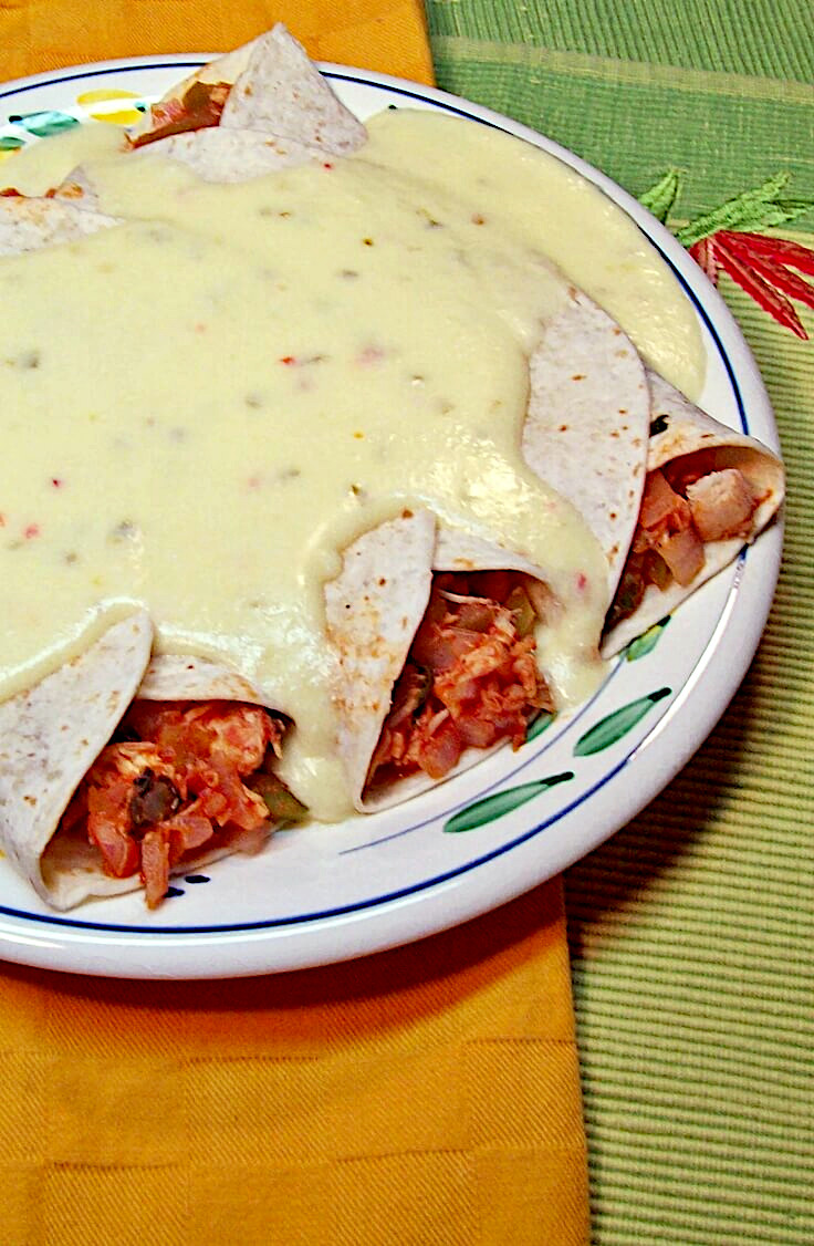 Chicken Enchiladas Smothered with Creamy Cheese Sauce